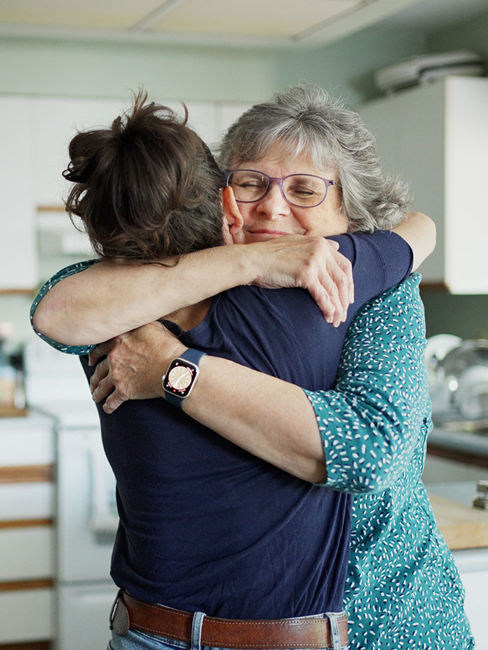 Two women hugging