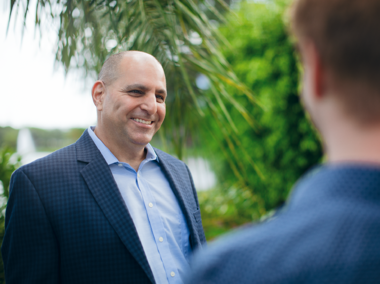 Two men talking outside