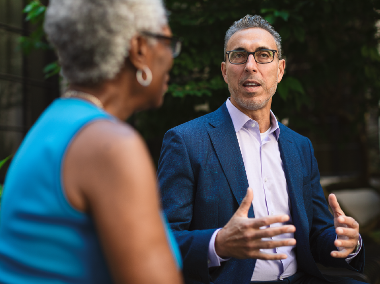 Man and woman talking in garden
