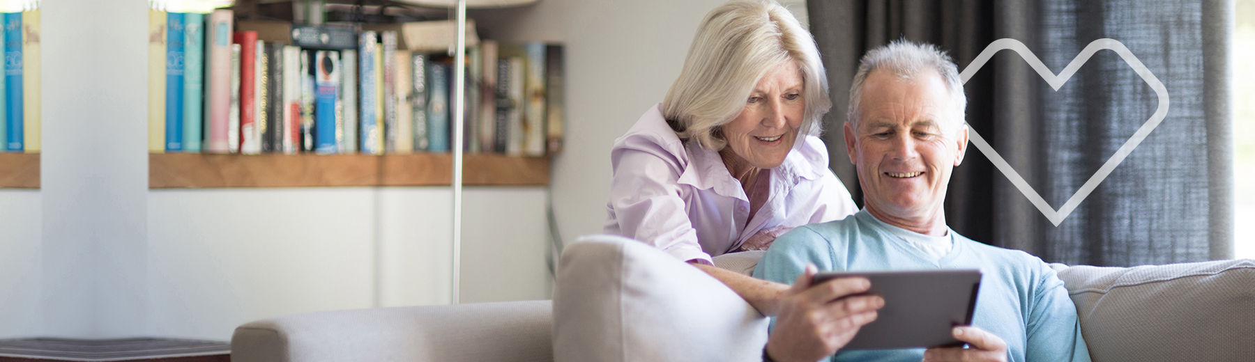 Senior couple looking at tablet