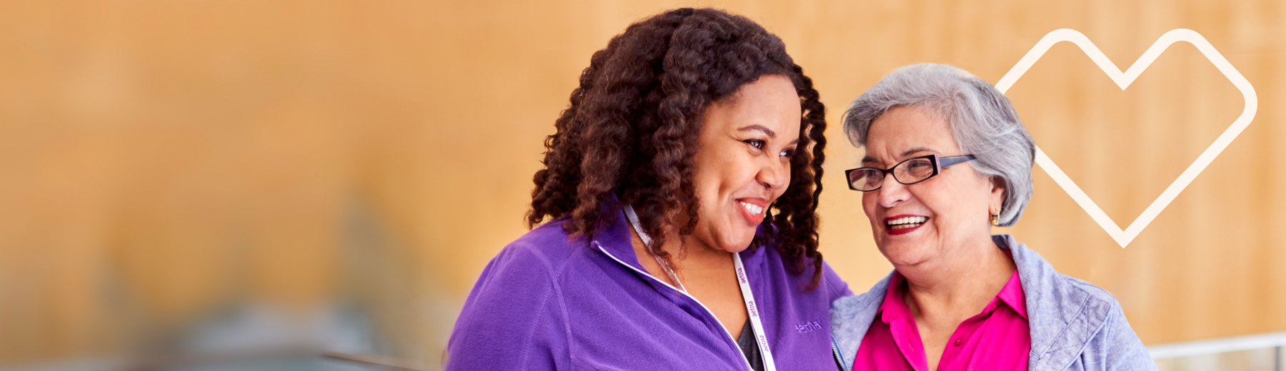 Care manager meeting with and putting her arm around a client