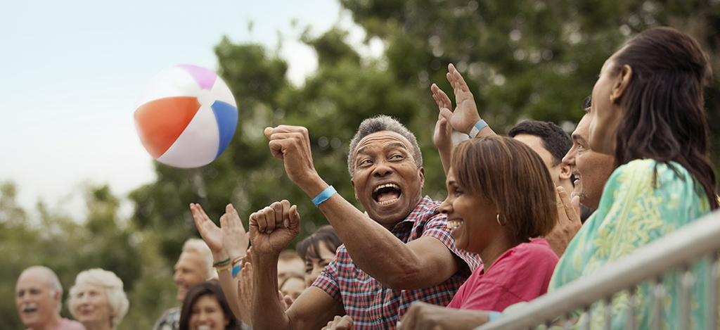 Senior African-American couple cheering at an event
